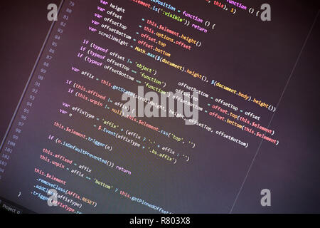 Colorful programming php and html source code on a monitor written by a young programmer. Stock Photo