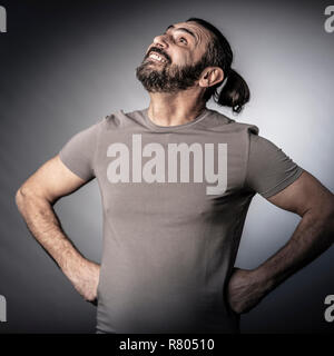 confident happy long hair man studio shot Stock Photo