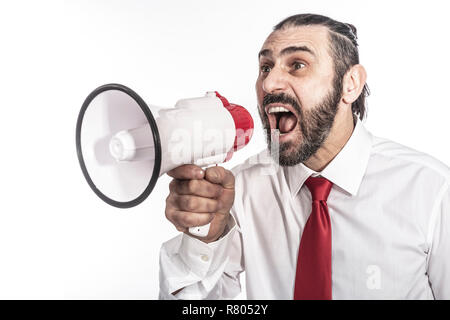 studio shot of caucasian businessman yellin in megaphone Stock Photo