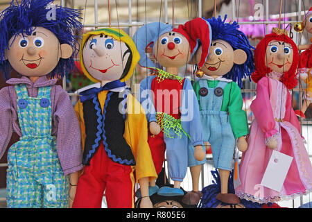 Traditional czech wooden puppets for sale closeup . Stock Photo
