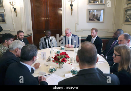 Actor Tom Hardy (2nd left), Tinie Tempah (3rd left) the Prince of Wales and the Duke of Sussex (4th and 5th left) during a discussion about violent youth crime at a forum held at Clarence House in London. Stock Photo