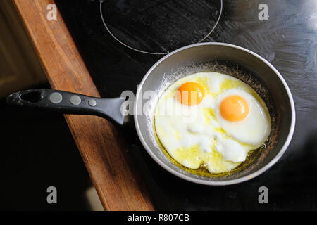 Fried eggs in a frying pan. Stock Photo