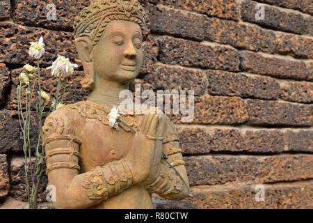 Angel statue put the palms of the hands together in salute, art of sculpture, Thailand Stock Photo