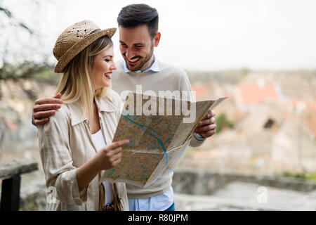 Tourist young couple using map as guide Stock Photo