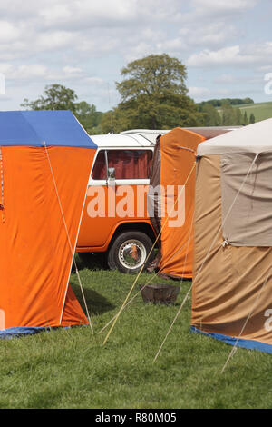 Classic orange cotton awnings at a vintage camping weekend festival Stock Photo