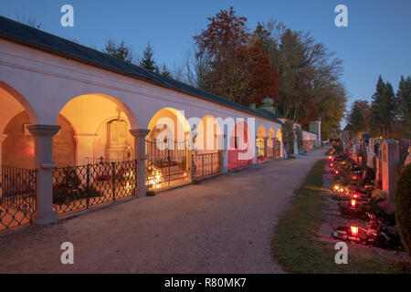 Cemetery in the village Teisendorf at All Saints Day with candles placed to honor deceased relatives. Upper Bavaria, Germany Stock Photo