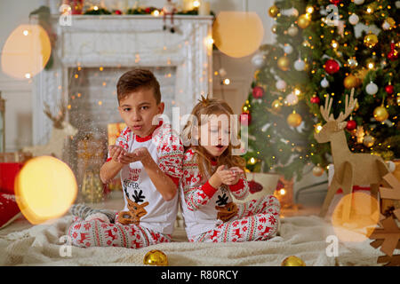 Adorable little girl and boy in Christmas time Stock Photo