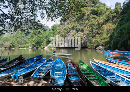 HPA-AN, MYANMAR - 19 NOVEMBER, 2018: Horizontal picture of boats and amazing river in the exterior of Sadan Cave in Hpa-An, Myanmar Stock Photo