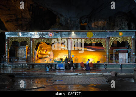 HPA-AN, MYANMAR - 19 NOVEMBER, 2018: Horizontal picture of huge reclined Buddha statue inside Sadan Cave, important landmark of Hpa-An, Myanmar Stock Photo