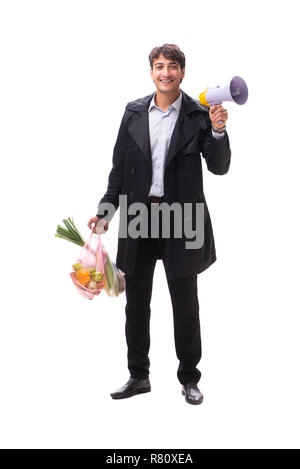 Young handsome man with vegatables in shopping concept Stock Photo