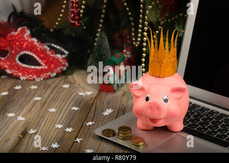 Pink piglet with golden crown on it. Closeup