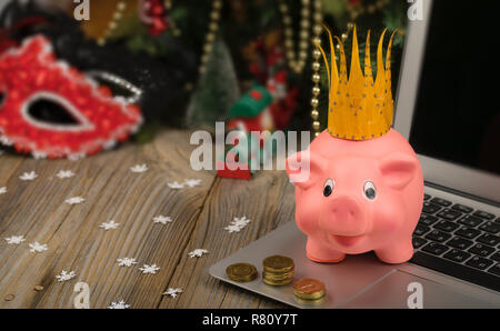 Pink piglet with golden crown on it. Closeup