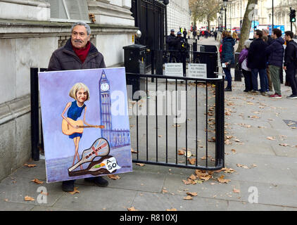 Kaya Mar - political cartoonist - with his painting of PM Theresa May busking, with Article 50 Stock Photo