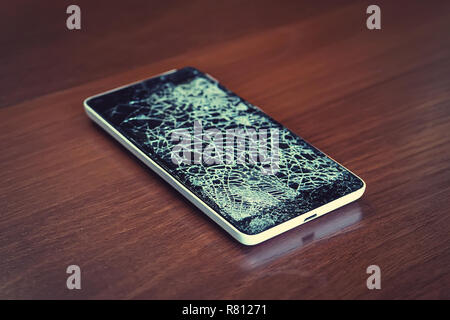 Black smartphone with broken screen Stock Photo