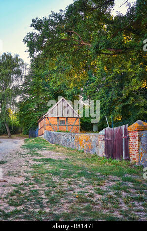 Small brick house in the woods at the cemetery in Benz. Usedom, Germany Stock Photo