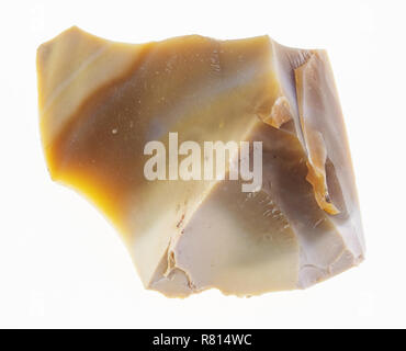 macro photography of natural mineral from geological collection - rough yellow Flint stone on white background Stock Photo