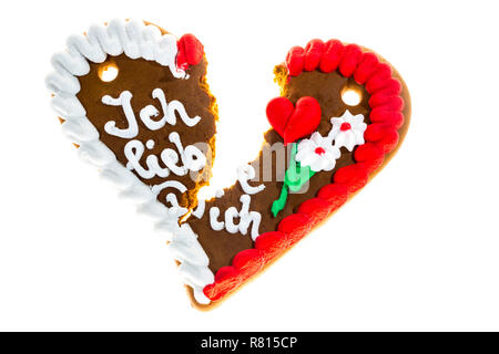 Broken gingerbread heart with the message 'Ich liebe Dich', German for 'I love you', symbolic image for separation or divorce Stock Photo