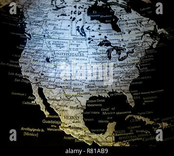 Close up view of silver on black background world globe map showing North America i.e. US aka USA aka United States aka United States of America , Canada and Mexico Stock Photo