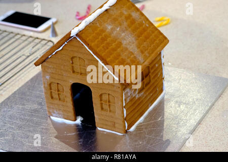 Step-by-step photos of the construction of a gingerbread house Stock Photo