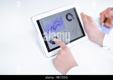 close up.businessman pointing with pen on a digital tablet screen. Stock Photo