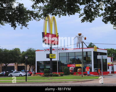 HOUSTON, TEXAS, USA - JUNE 9, 2018: NASA themed McDonald's restaurant in Houston, Texas. A giant astronaut with French fries on rooftop. Stock Photo