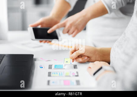 web designers creating mobile user interface Stock Photo