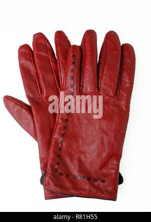 Pair of rusty red colored gloves on white. Stock Photo