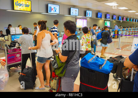 CHIANG MAI, THAILAND - JAN 12, 2017: People waiting in queue at check-in counter in airport. Chiang Mai International Airport is an international airp Stock Photo