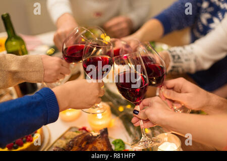 close up of friends with wine celebrate christmas Stock Photo