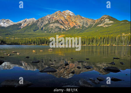 A fall landscape image of Pyramid mountain over Pyramid Lake in Jasper National Park Alberta Canada. Stock Photo