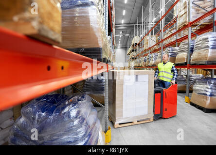 loader operating forklift at warehouse Stock Photo