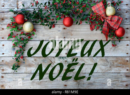 Christmas postcard frame with wood background. For greeting card. Red, golden and white. Xmas wallpaper. 'joyeux noel' Stock Photo