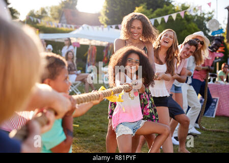 Game Of Tug Of War At Summer Garden Fete Stock Photo