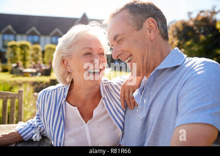 Senior Couple Relaxing At Outdoor Summer Cafe Together Stock Photo