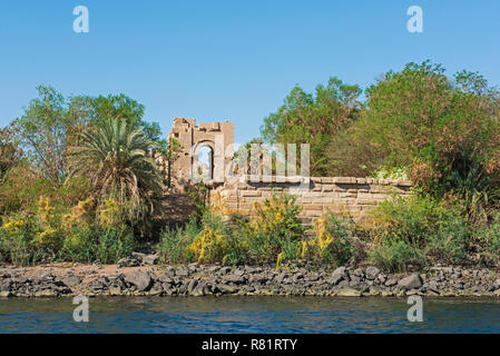 View from Nile river of a kiosk at the ancient egyptian Temple of Isis in Philae Island Aswan Stock Photo