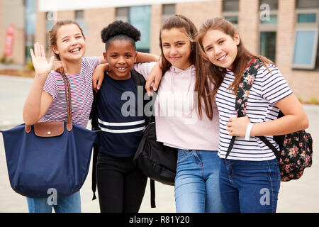 Portrait Of Female High School Student Friends Standing Outside School Buildings Stock Photo