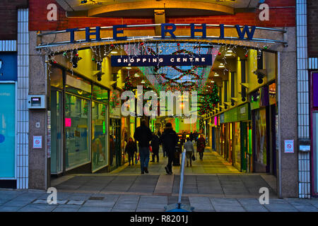 Shoppers enjoying strolling under the Christmas lights inThe Rhiw, an indoor shopping centre & market in the centre of Bridgend, South Wales. Stock Photo