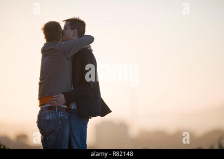 Young homosexual couple hugging. Stock Photo