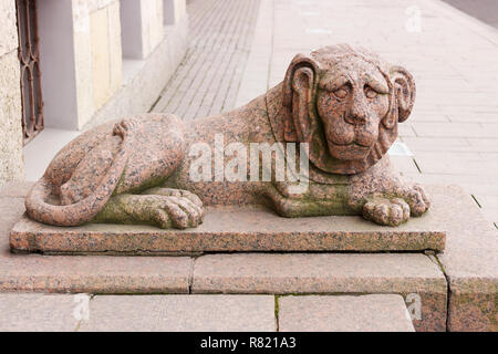 One of two granite lions at the entrance to the building of the Constitutional Court of the Russian Federation on English Embankment 4 in St. Petersbu Stock Photo