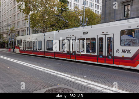 Portland, Oregon,USA - October 8, 2016:  Portland, Oregon Max Trail travels down a transit only street in the city. Stock Photo