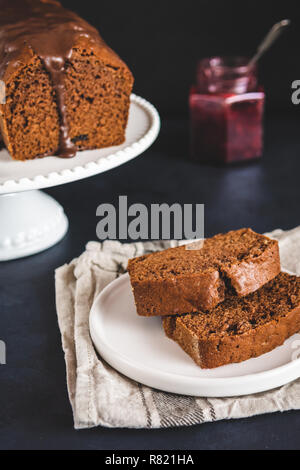 Homemade gingerbread cake on white plate. Honey cake. Stock Photo