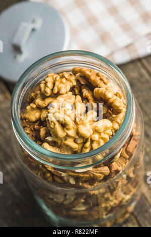 The walnut kernels in jar. Stock Photo