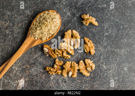 Milled and whole walnuts kernels. Stock Photo