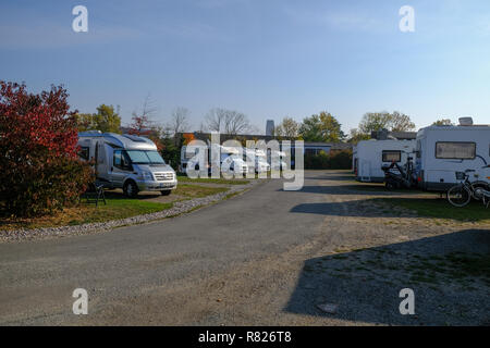 Caravan parking ground or camping place or Campingplatz with caravans or camping trailers in Wismar, Germany during sunny day Stock Photo