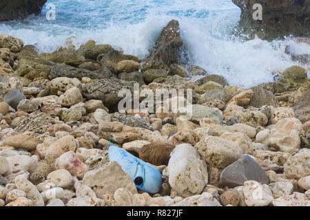 Plastic waste washed in from the sea contaminates rocks and beaches in the Caribbean Stock Photo