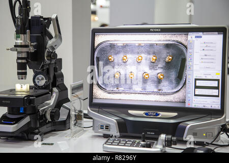 Bangkok, Thailand - November 21, 2018: Surface roughness evaluation of workpiece by optical microscope display in Metalex 2018 Stock Photo