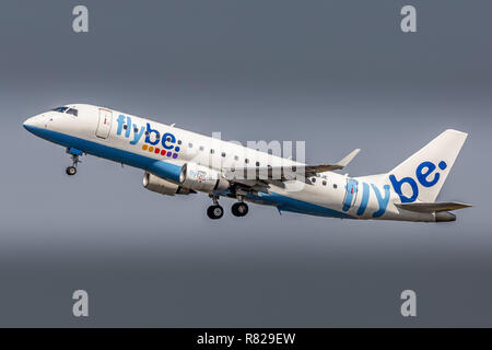 An Embraer ERJ-175 airliner, registration G-FBJE, of the British Airline Flybe, taking off from Manchester Airport in England. Stock Photo