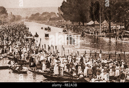 Oars raised in salute as the Royal Barge bearing  King George V and the Royal family makes its way down the regatta course on July 6th 1912 at Henley-on-Thames, a town on the River Thames in Oxfordshire, England.  It was the only occasion that the king attended Henley Royal Regatta, even though it became 'Royal' in 1851, when Prince Albert became patron of the regatta. Stock Photo