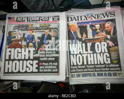 New York, NY/USA- December 12, 2018 Headlines of New York newspapers on Wednesday, December 12, 2018 report on the previous days' contentious meeting between US President Donald Trump and Congressmember Nancy Pelosi and Senator Charles Schumer over the border wall and a government shutdown. (Â© Richard B. Levine) Stock Photo