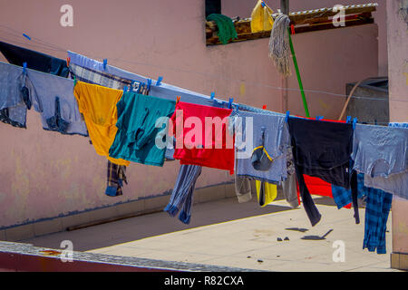 OTAVALO, ECUADOR, NOVEMBER 06, 2018: Outdoor view of clothes drying in the sun in Otavalo Stock Photo